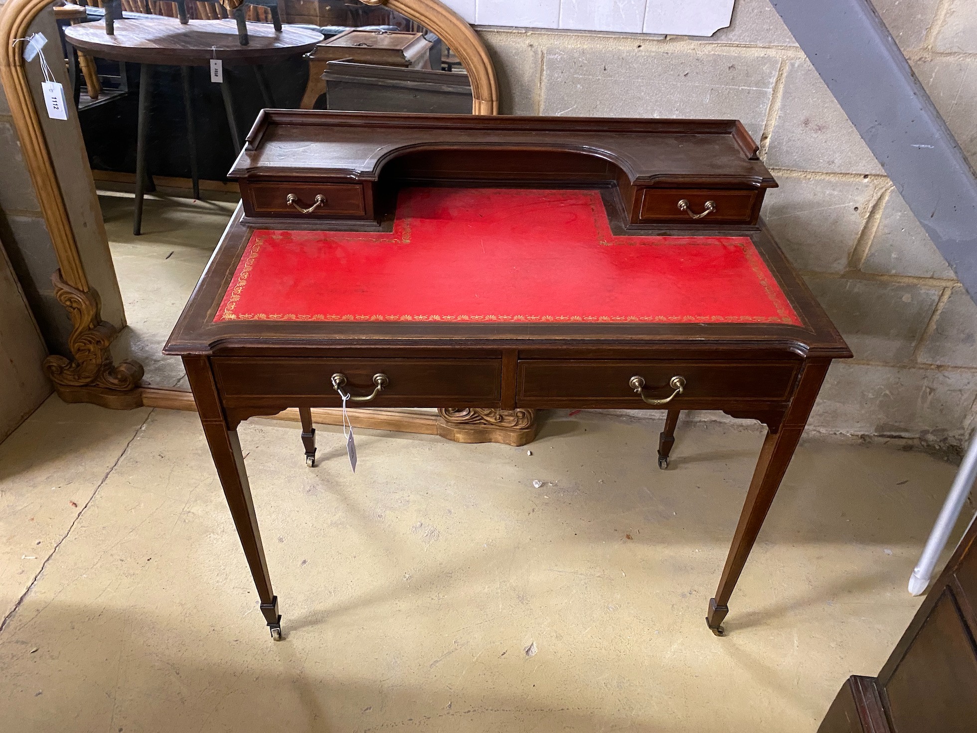 An Edwardian inlaid mahogany writing table, width 91cm